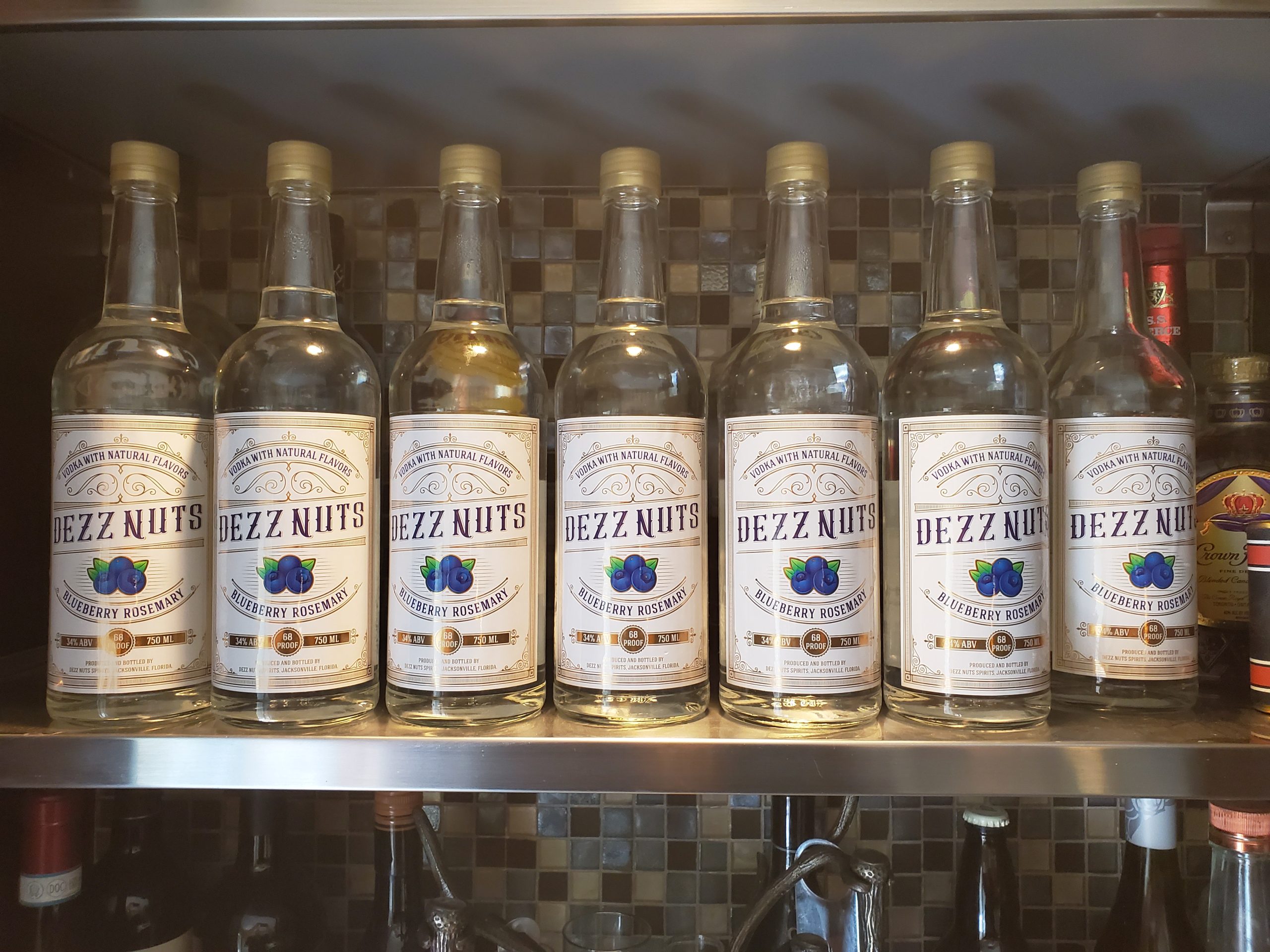 Row of whiskey bottles on a shelf